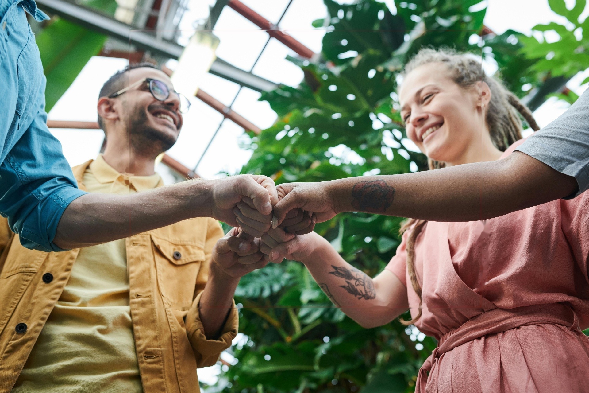 Friends celebrating and connecting with a fist bump